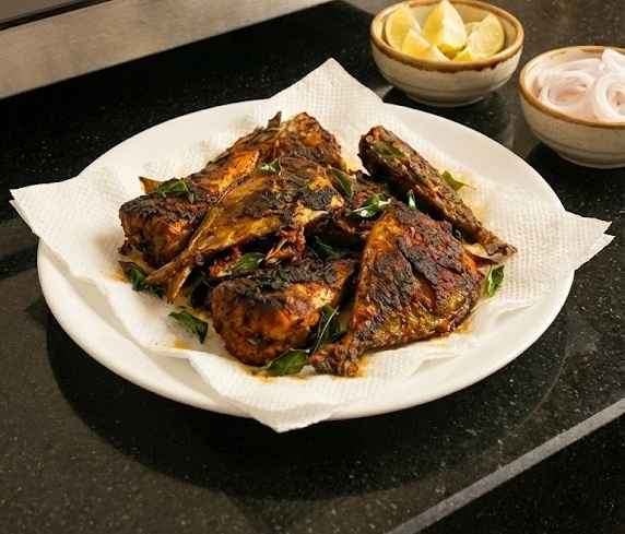 Crispy Fish Fry | மீன் வறுவல் served hot with curry leaves, onion and lemon wedges – easy home style shallow fried fish