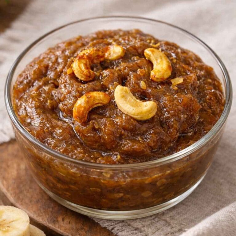 banana halwa recipe with jaggery made using ripe bananas and topped with roasted cashews