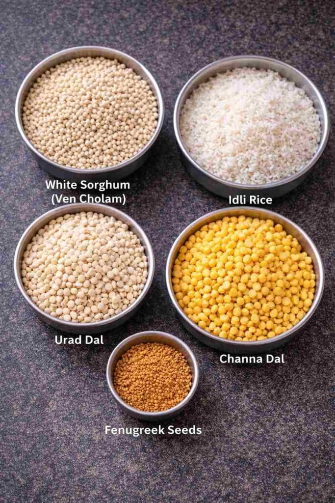Jowar dosa ingredients including white sorghum, idli rice, urad dal, channa dal and fenugreek seeds for cholam dosai recipe