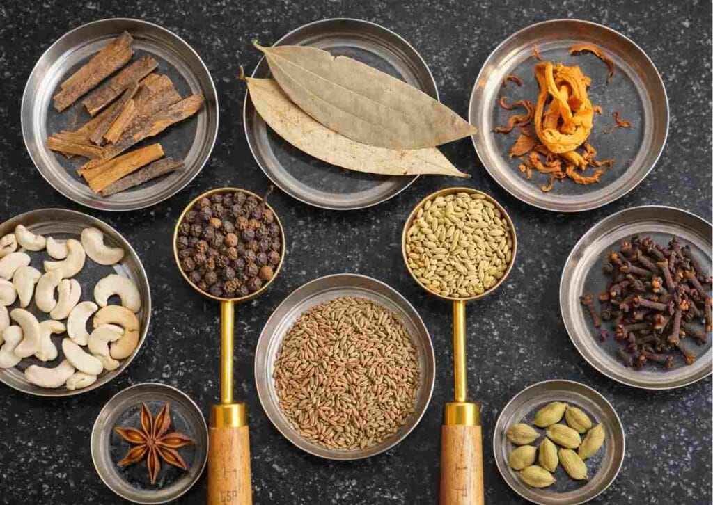Whole spices like cinnamon, cloves, fennel, pepper, cardamom and bay leaf used to make Thalappakatti biryani masala powder.
