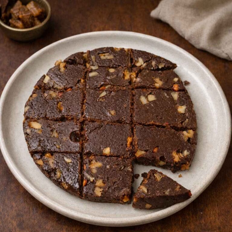 Soft ragi burfi with palm jaggery cut into squares with cashews and walnuts