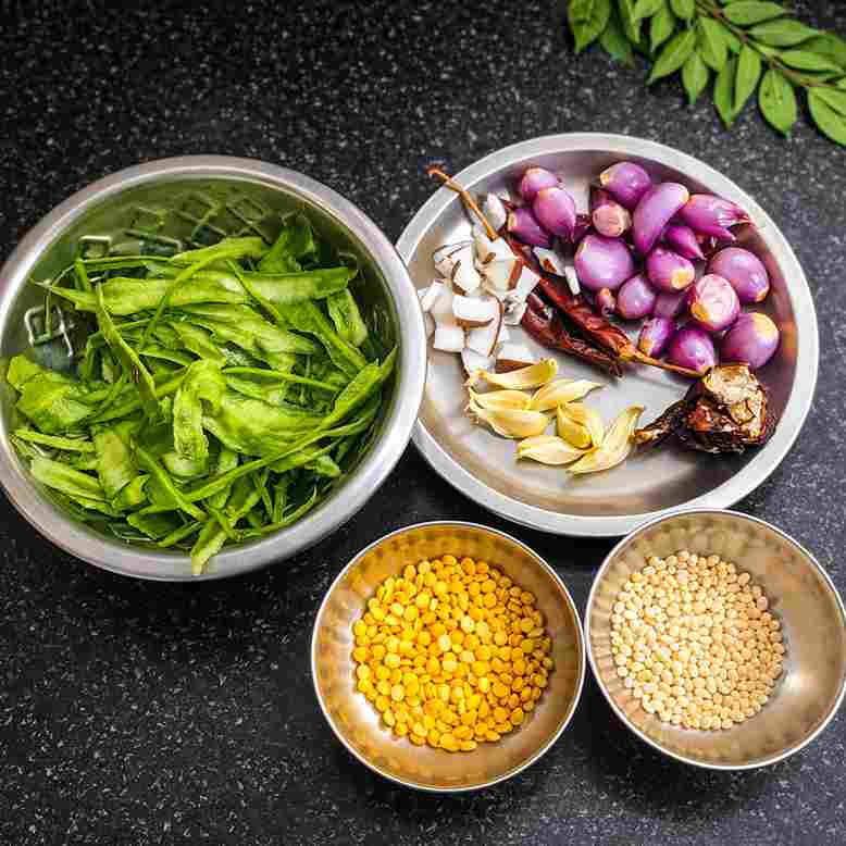 Ingredients for peerkangai thol thuvaiyal including ridge gourd skin, dal, onion, garlic and spices