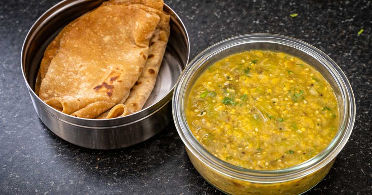 Peerkangai kathirikai masiyal served with chapati in a steel lunch box — ridge gourd brinjal dal ready in 15 minutes