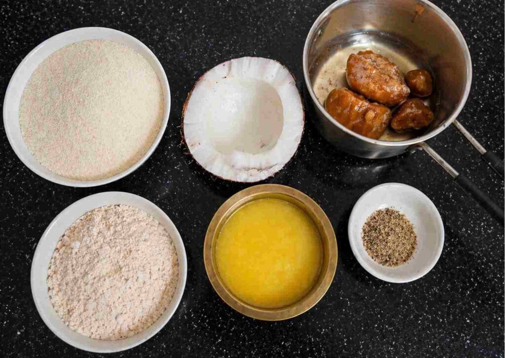 Ingredients for sweet paniyaram including rava, jaggery, coconut, wheat flour and ghee
