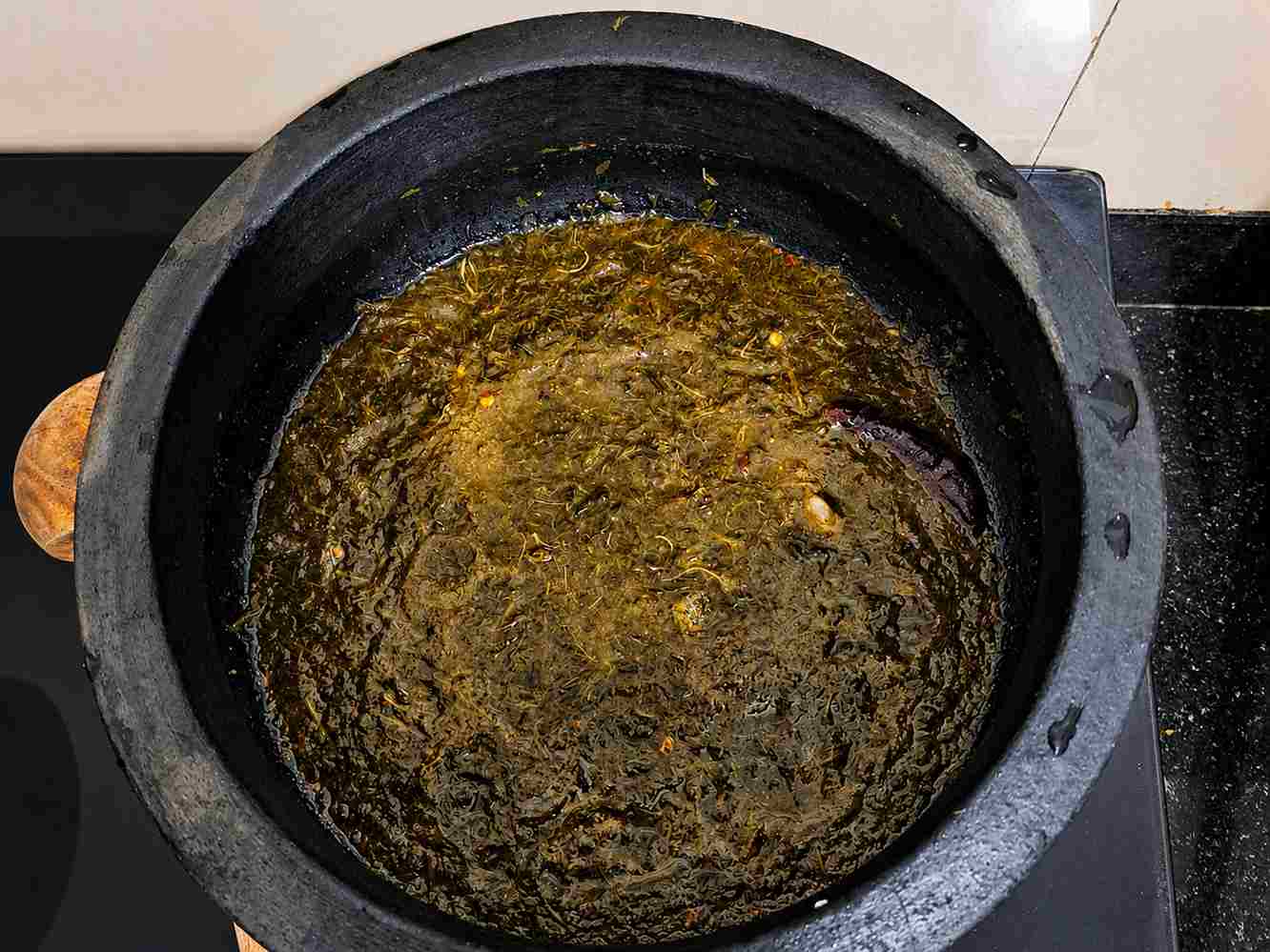 Iron rich siru keerai masiyal without dal cooked in clay pot with soft texture and traditional South Indian flavor