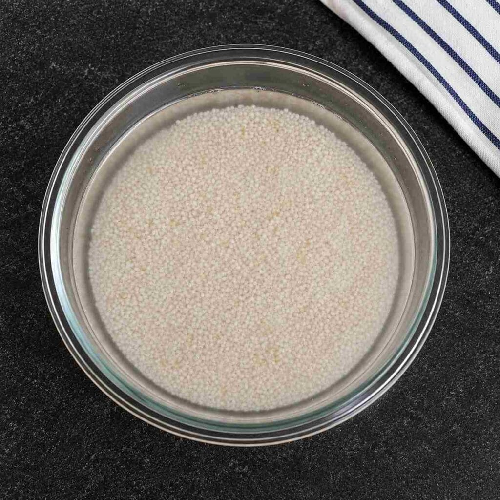 Kodo millet soaked in water for making varagu upma