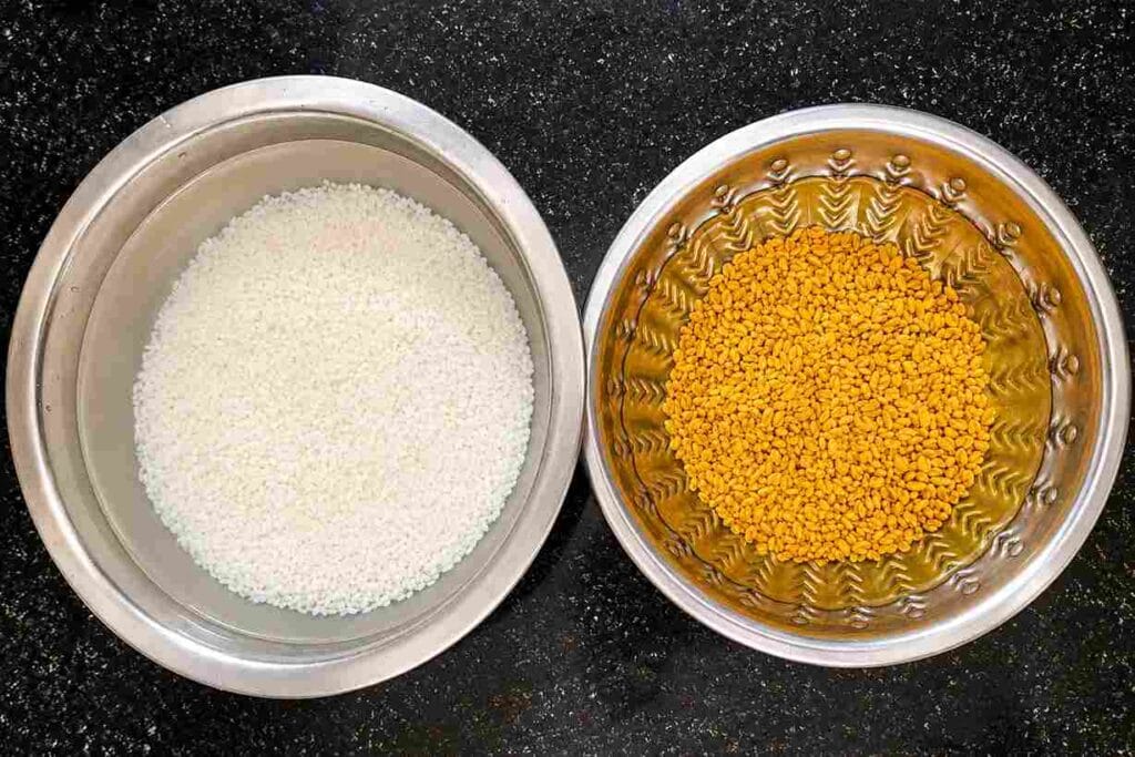 Idli rice and fenugreek seeds soaked separately for traditional vendhaya kali recipe