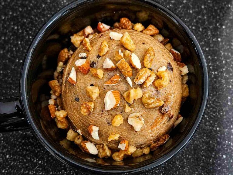 healthy frozen banana ice cream topped with mixed nuts in a bowl