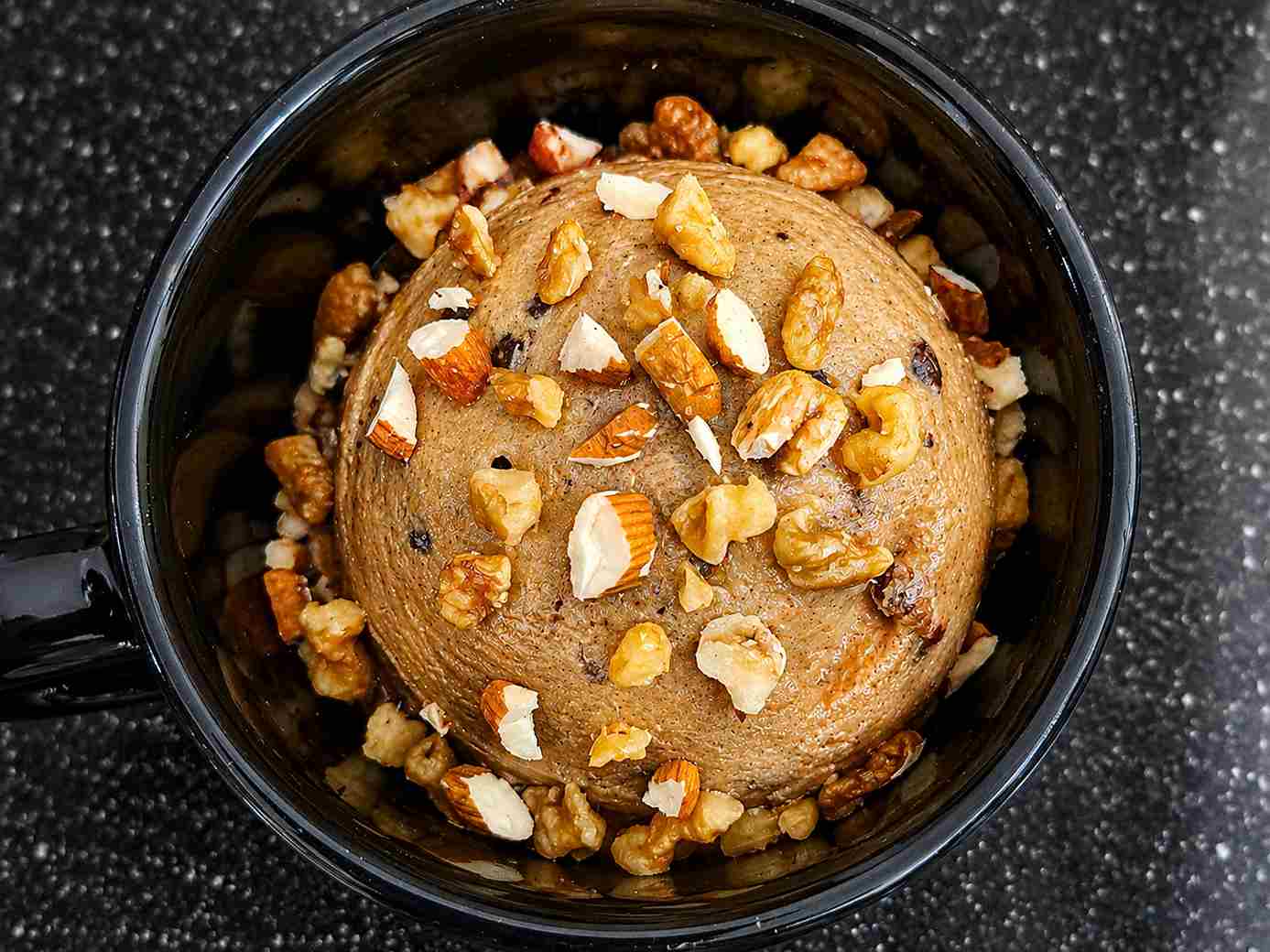 healthy frozen banana ice cream topped with mixed nuts in a bowl