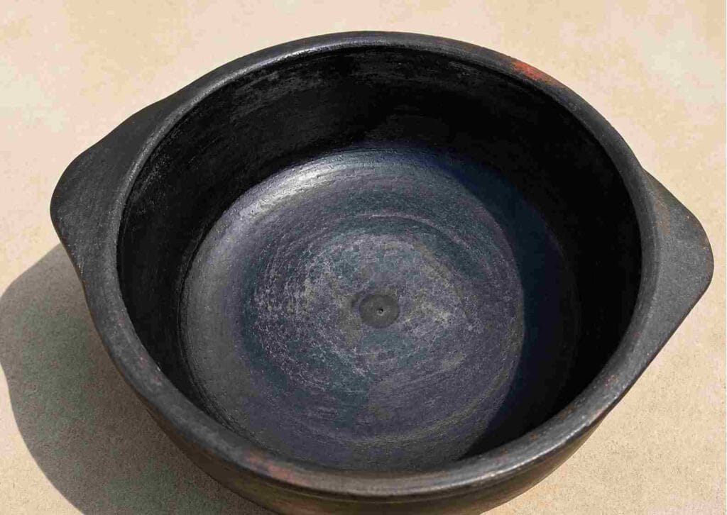 sun dried clay pot after preparation showing dry surface and ready condition for cooking in traditional earthen cookware