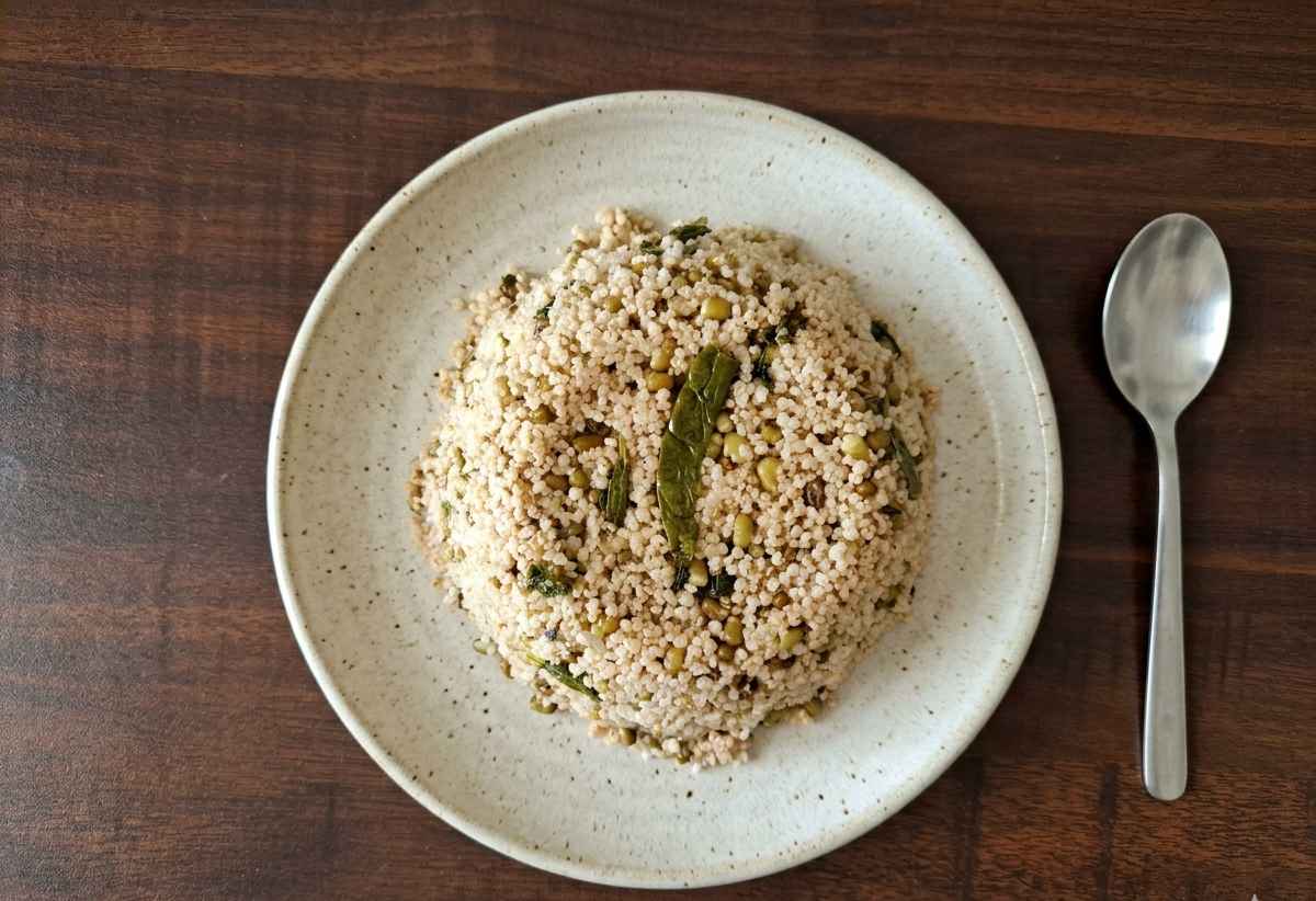 Pacha Payaru Kodo Millet Pulao made with varagu arisi, whole green gram, herbs, and spices.