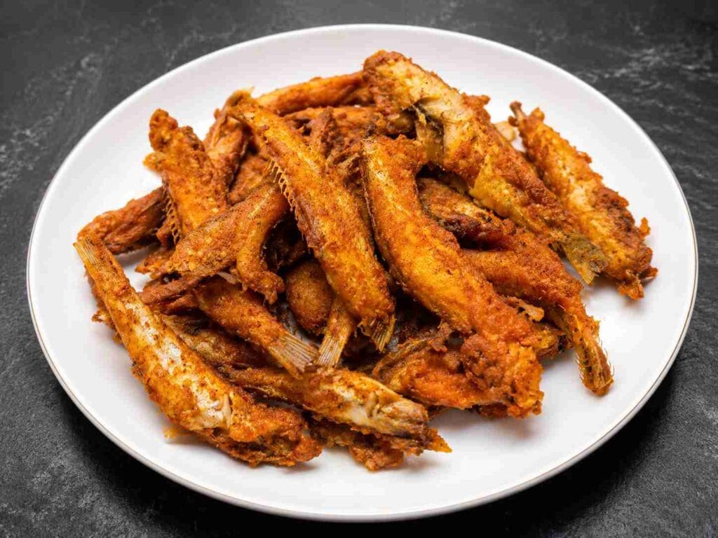 Crispy nethili fry recipe served in a plate with spicy golden brown masala coating.