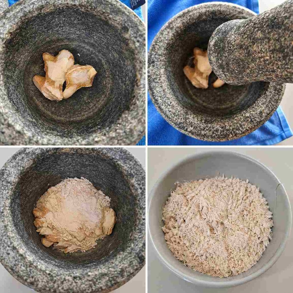 Dry ginger crushed in a stone mortar for homemade Sukku Malli powder
