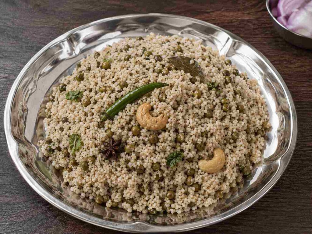 Healthy lunch box recipe made with pacha payaru, kodo millet, herbs, and spices served on a plate.