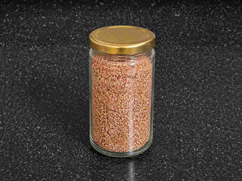 Homemade Kullakar Rice Kanji Powder stored in an airtight glass jar