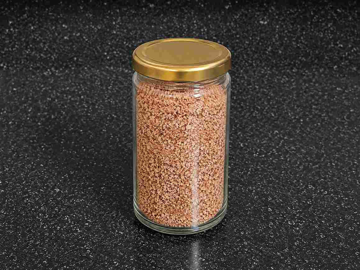 Homemade Kullakar Rice Kanji Powder stored in an airtight glass jar