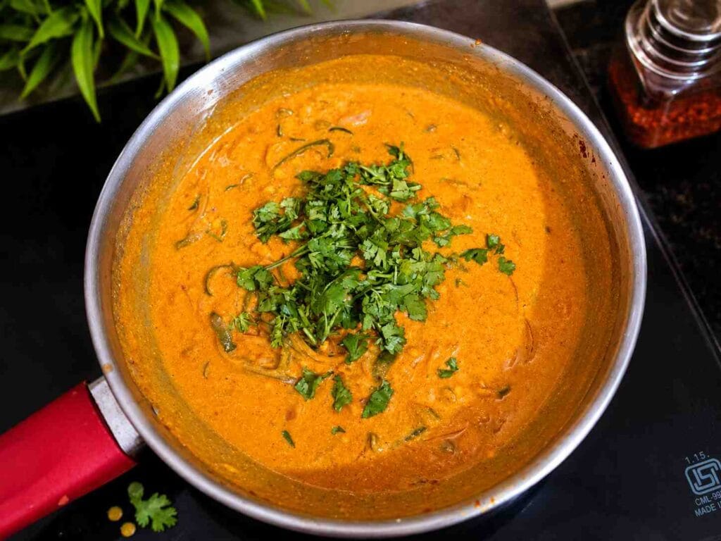 Creamy Capsicum Curry Recipe garnished with fresh coriander, ready to serve as a side dish for chapati, roti, dosa, and rice.
