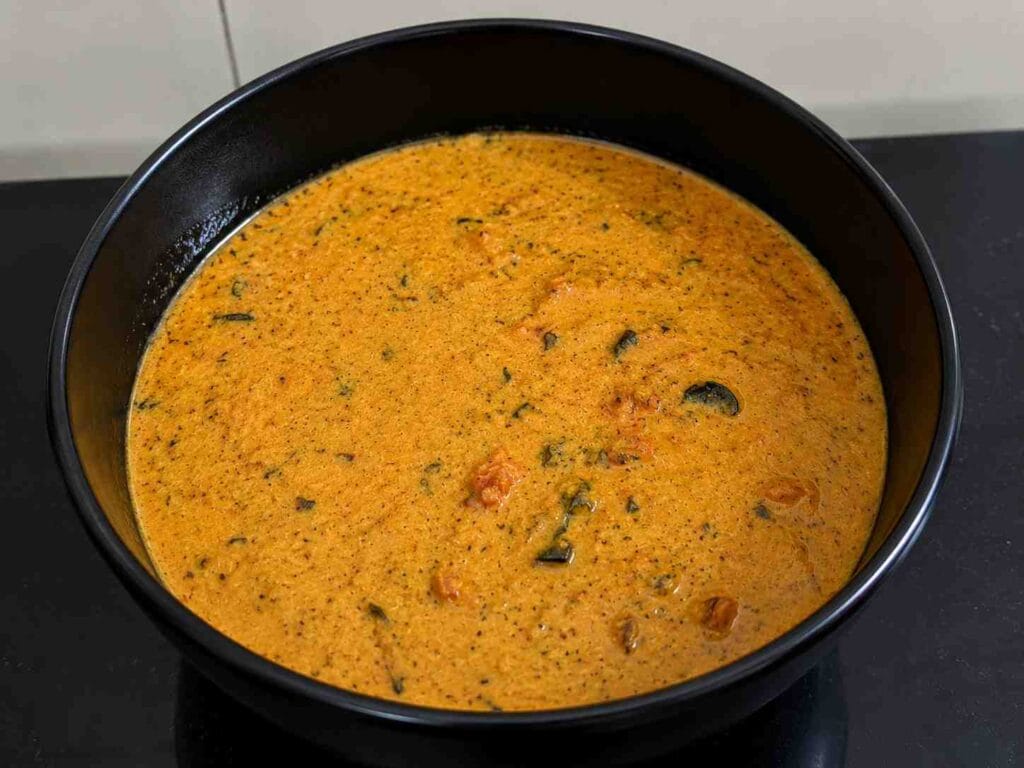 Freshly prepared Pressure Cooker Parotta Salna with a smooth, aromatic hotel-style gravy served in a bowl.