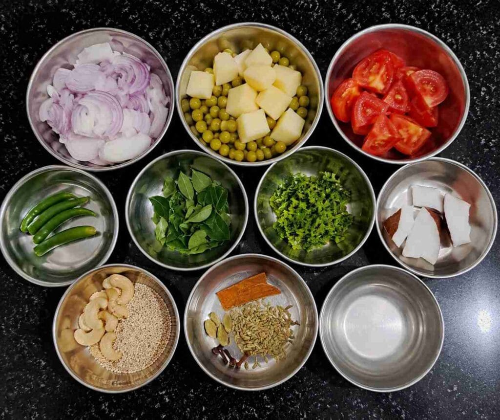 Ingredients for Pattani Kurma including green peas, potatoes, onions, tomatoes, coconut, spices, and fresh herbs