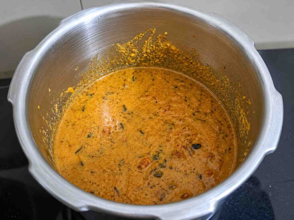 Freshly cooked Pressure Cooker Parotta Salna with a smooth, aromatic gravy and authentic hotel-style consistency, ready to serve.