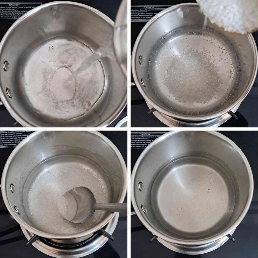 Sugar dissolving in water in a stainless steel saucepan