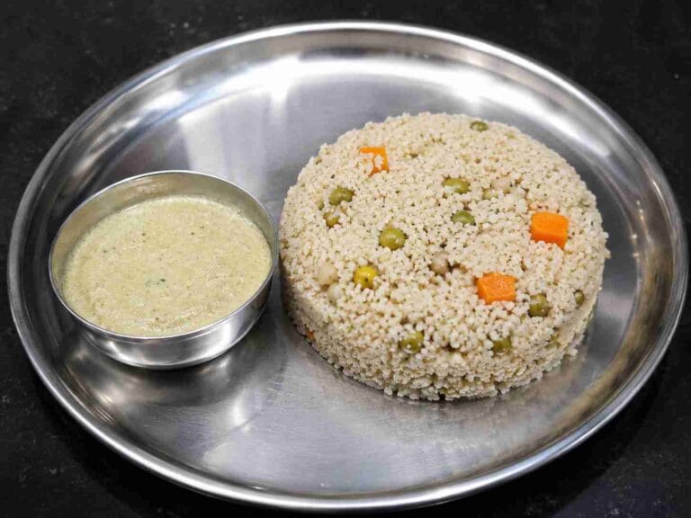 A plate of Thinai Upma with carrots and green peas served with chutney